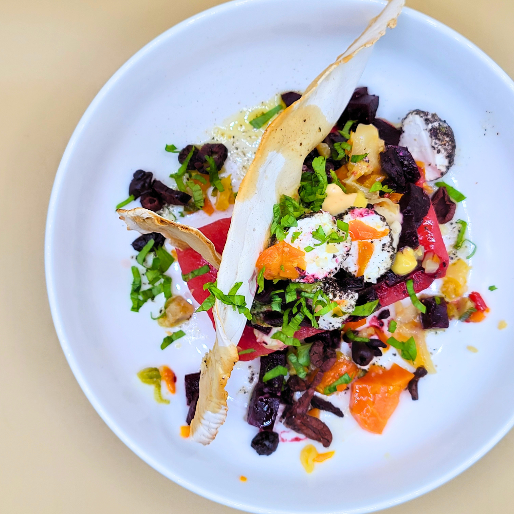 Beet and watermelon dish with yogurt cheese and cassava cracker.